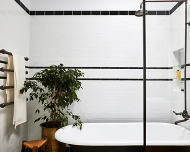 A claw foot bath in a 1920s inspired art deco bathroom.