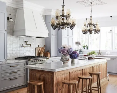 Alexandra Nea's kitchen with chandeliers over bench