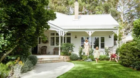 Alexandra Nea's white weatherboard home, verandah and garden