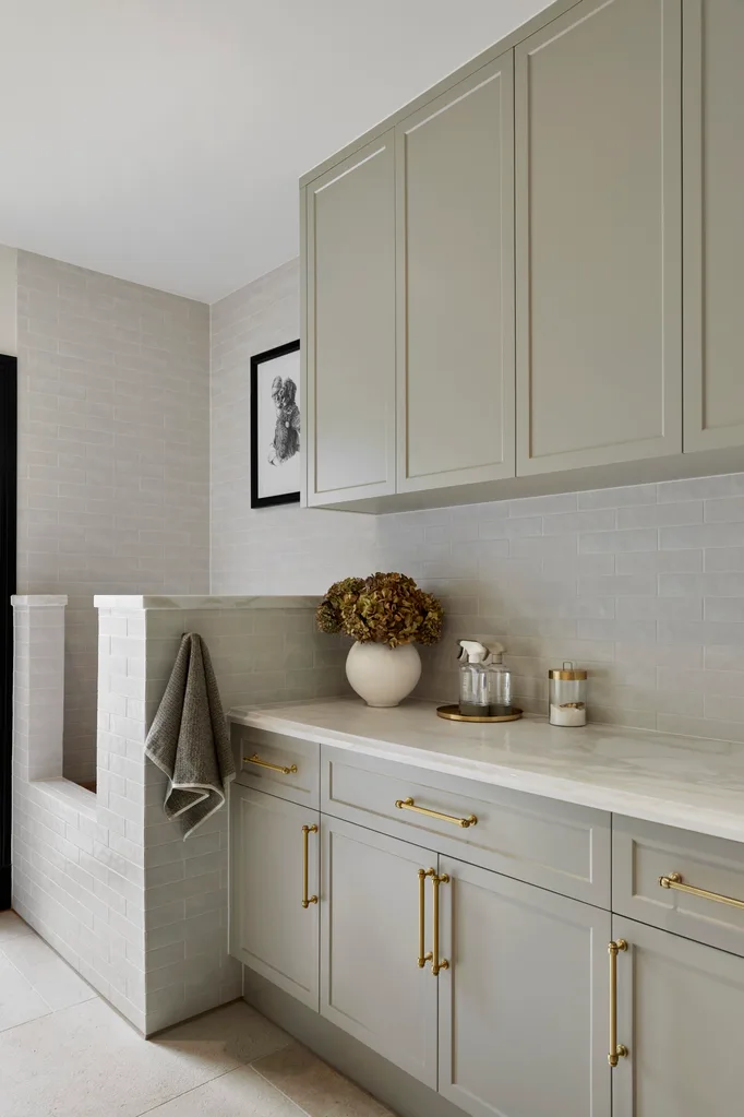 Alisa and Lysandra Brighton bungalow sage green laundry with dog washing station