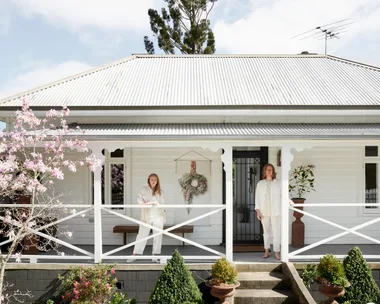 The exterior of the white cottage owned by Austin Bloom florists.