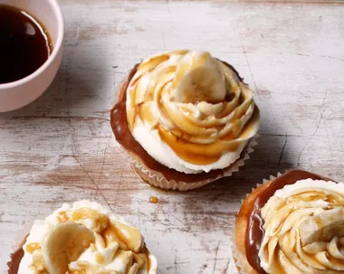 Banoffee pie cupcakes on a board with toffee sauce