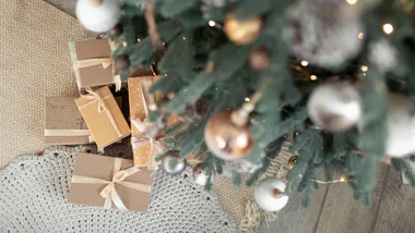 Close up of Christmas tree, overhead shot of presents