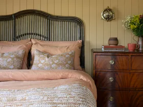 The bedroom inside a century old country cottage.