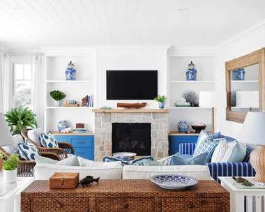 coastal blue and cream living room with sandstone fireplace