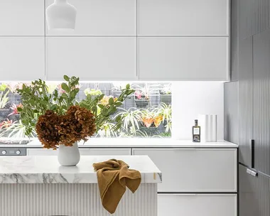 Modern dual tone kitchen with white cabinets