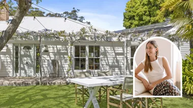 Eleanor Pendleton sells her charming house exterior with patio set and vine-covered pergola.