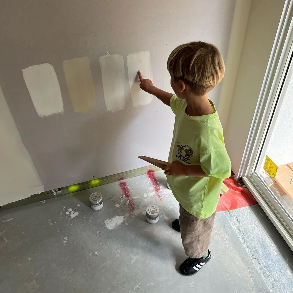 Ellie Watson's son pointing out paint samples