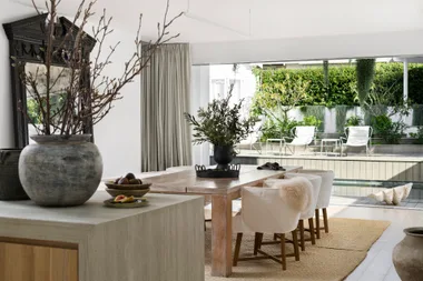 The open-plan dining area overlooking the pool and garden.