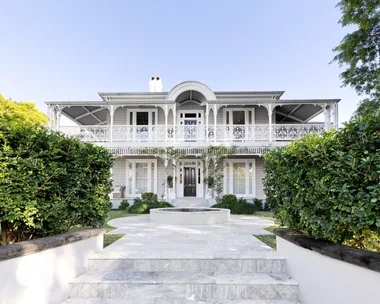 The Victorian exterior of a historical home in Brisbane.
