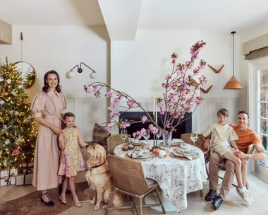 Kate Nixon with her family in front of her Christmas Tree