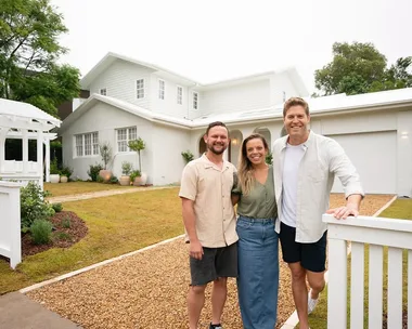 Lara and Peter Dream Home team with Dr Chris Brown outside their place