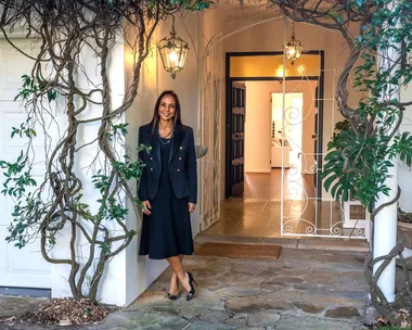 DLeanne Lewis outside a house entry with vines at the door