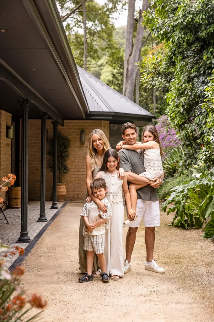 Rachel and Ryan Carr with their three children at their South Coast holiday house.