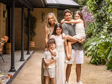 Rachel and Ryan Carr with their three children at their South Coast holiday house.