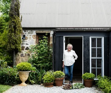 Restored stone cottage with black exterior