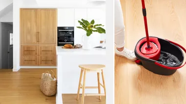 Modern kitchen with wood cabinets, white countertop, stool, basket, and a mop bucket on wooden floor.