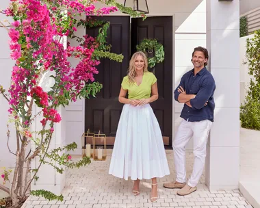 Tim and Anna Robards outside their home with bougainvillea framing the entry