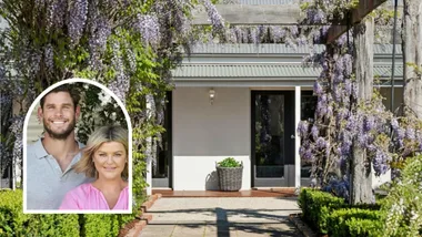 Portrait of ex-AFL player Tom Hawkins and wife Emma Hawkins with their Barrabool farmhouse.