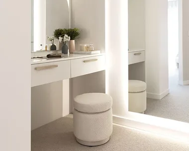 White walk in wardrobe with dressing table