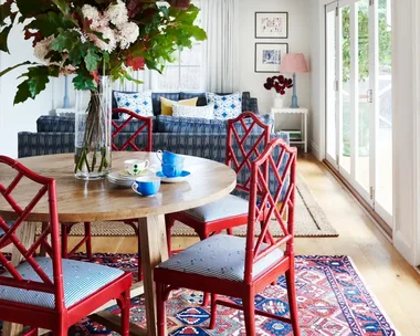 Dining and living area with pops of red and blue.