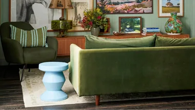 Green upholstery couch in vibrant living room