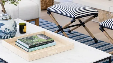 a collection of books and homewares on a coffee table
