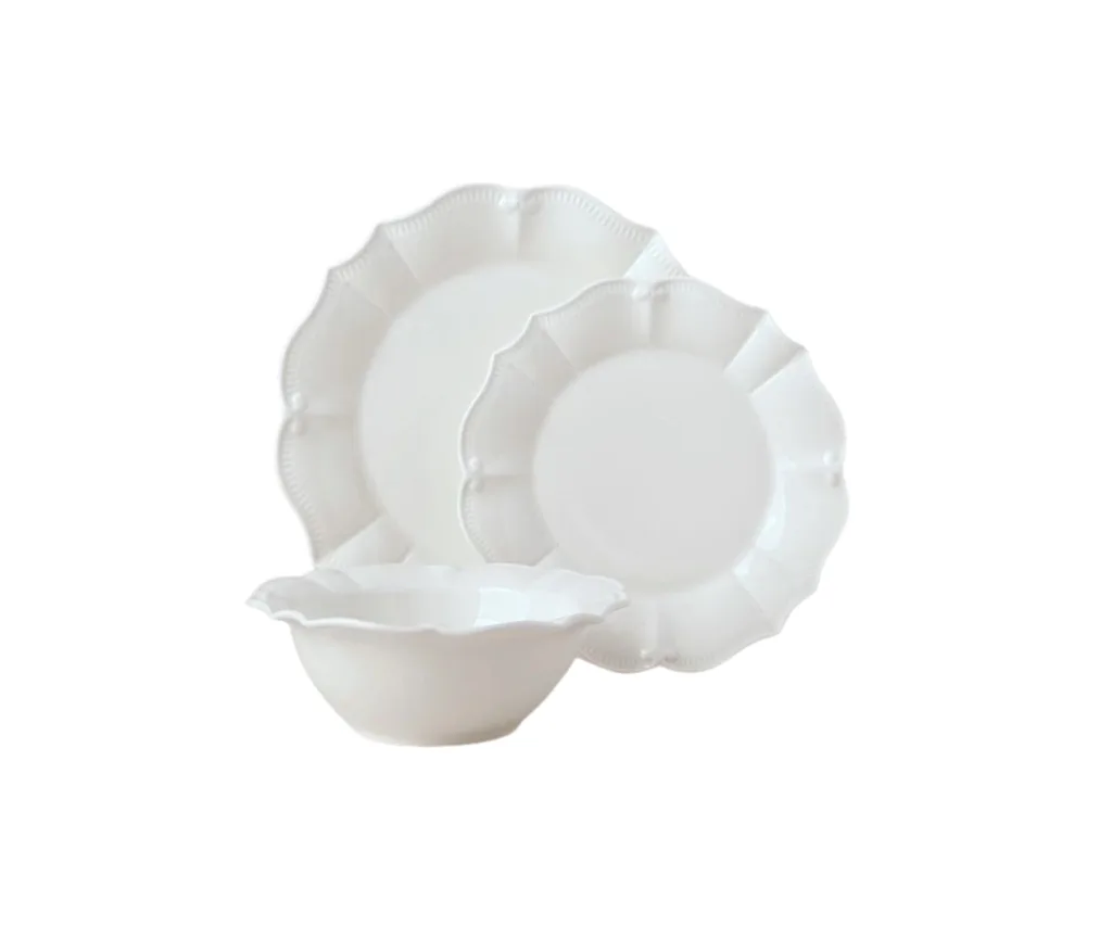Product photo of Heritage Bella Scalloped Dinner Set (12-piece), ranked best dinnerware set for vintage elegance. Features a transparent porcelain finish and delicately detailed edges/