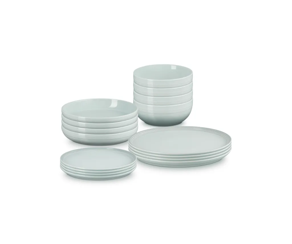 Product shot of Le Crueset Stoneware Coupe Dinnerware Set (16-piece), ranked our best overall dinnerware set, in sea salt colourway against a white background.