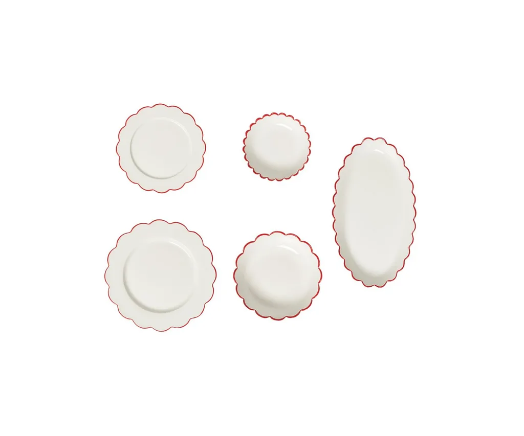 Product shot of In the Roundhouse Red Edge Scallop Dining Set (17-piece), ranked our best dinnerware set for adding a touch of whimsy. The set is white with a scalloped edge featuring a bright red outline