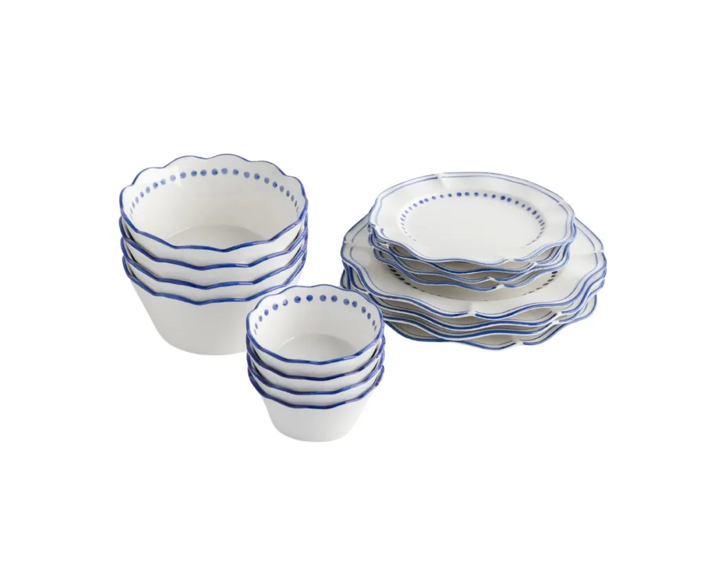 Product image of No. 22 Capri Plates and Bowls (16-piece), ranked our best dinner set for it's hand painted design. The set is white porcelain with handpainted blue details around the rim